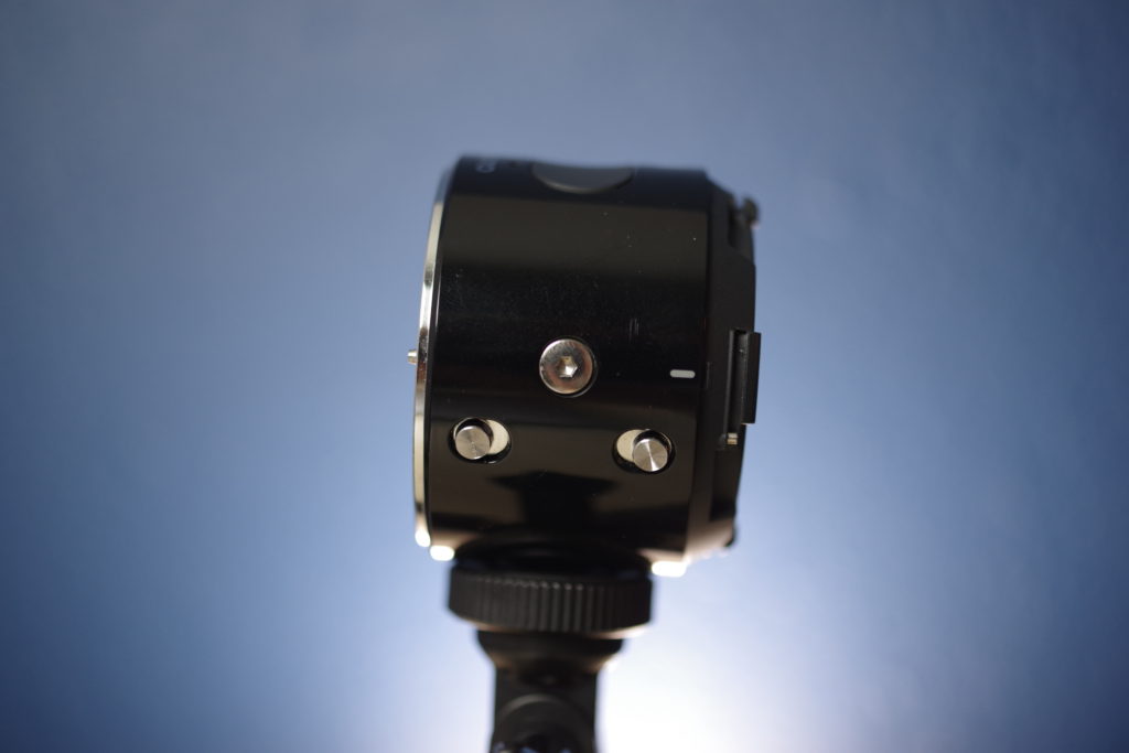 Olympus Air A01 Lens and Rear Cap Release Switches
